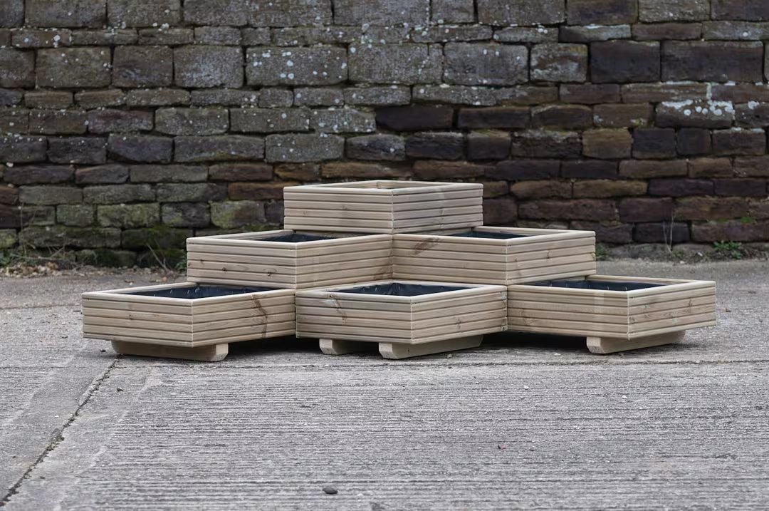 Custom wooden planter set arranged for a garden corner