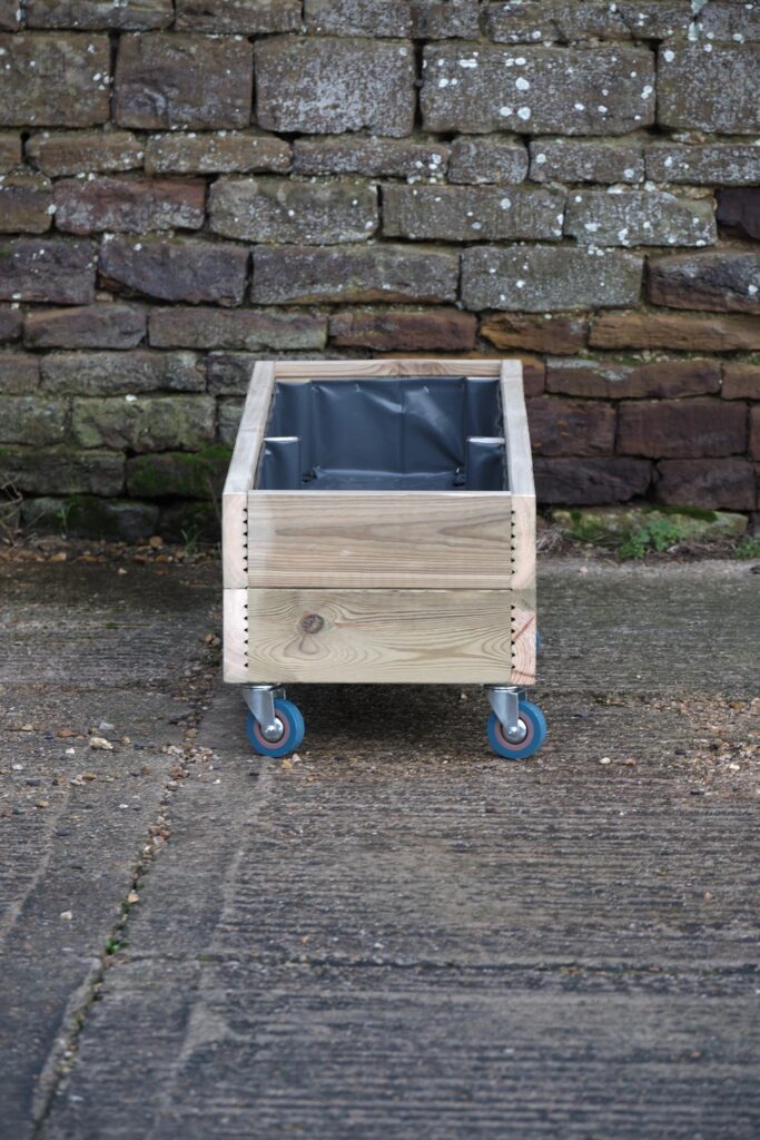 Wooden planter on castor wheels