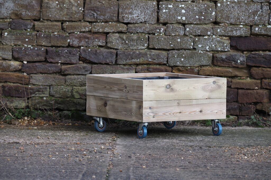 Compact square wooden planter with trellis on wheels